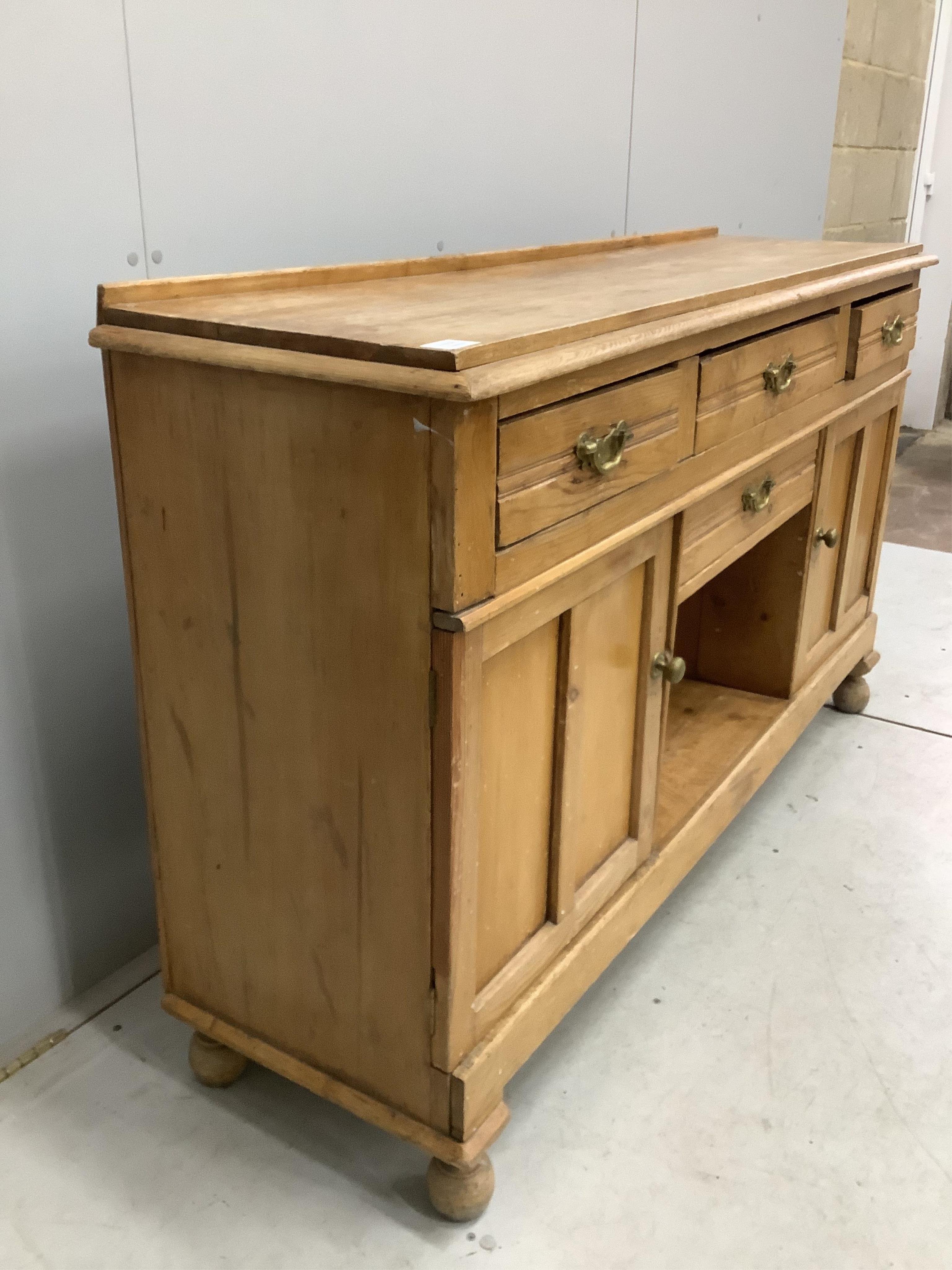 A late Victorian pine low dresser, width 154cm, depth 42cm, height 90cm. Condition - fair